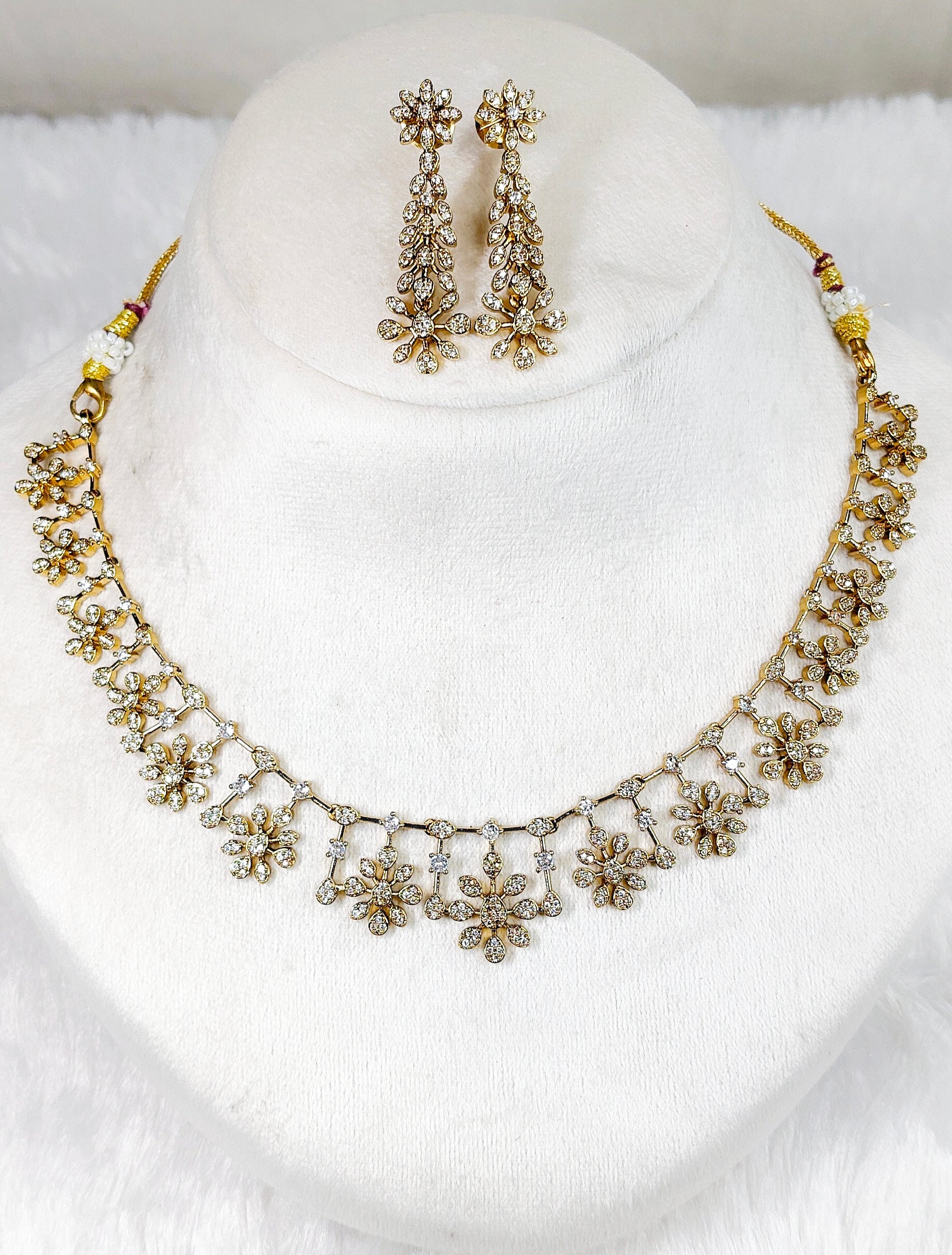 Gold Toned AD Stone Neckpiece
with Earrings